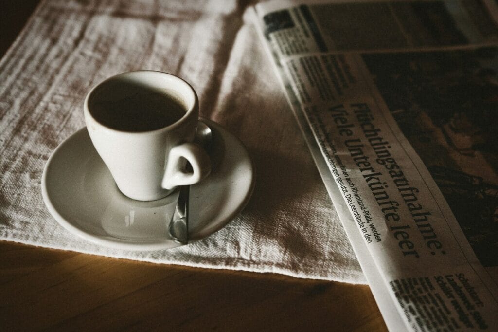 A cup of coffee and a newspaper