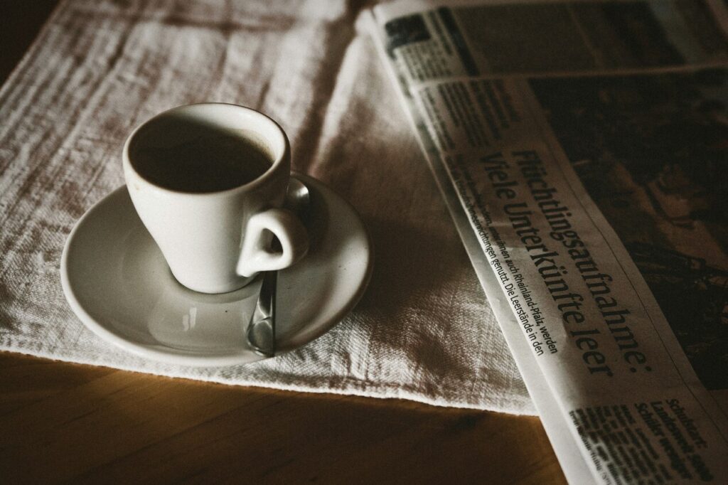 A cup of coffee and a newspaper