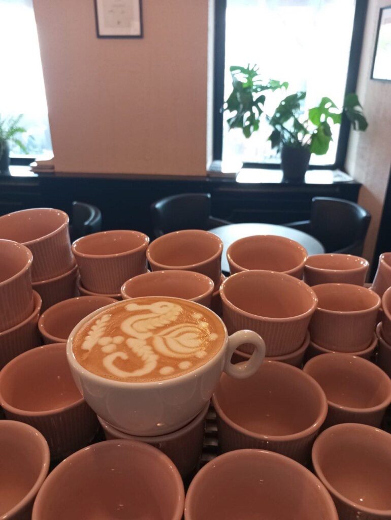 latte art and coffee cups