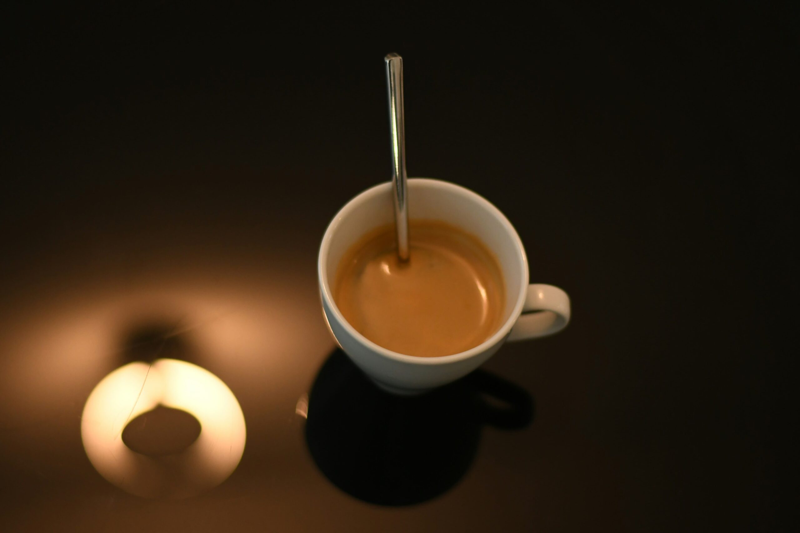 a cup of coffee with a spoon